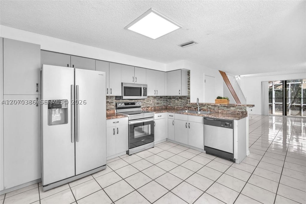 Photo of 800 Sorrento Dr #2, Weston, FL 33326 (MLS # A12070386)