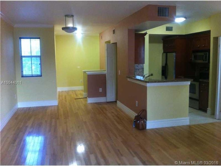 Beautiful lakeview resort-style living in open floor plan townhome style condo with attached garage and walkway to your own entrance. Easily accessible to major highways I-75, turnpike, I-95. Minutes from both Miami and Fort Lauderdale airport. Walk around the beautiful lake and enjoy the bird sanctuary. Watch the lit waterfall and beautiful bridge at night from your large balcony. 2 huge pools,tennis courts, clubhouse and gym enhance your life style. Wont last.