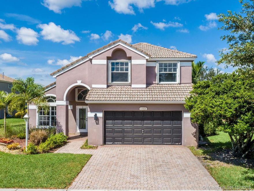 Every so often, a beauty like this one comes along in the sought after Pembroke Falls! This fabulous Malibu home was completely remodeled in 2016. Located just mins away from Pembroke Gardens w/ quick access to I-75, this gorgeous baby features 4 beds/2.5 baths. Custom designed kitchen w/ quartz waterfall counter tops. Stainless Samsung kitchen appliances. Redesigned master bath. Second closet added to master bedroom. Custom California style closets. Modern ceramic tile & stylish laminate floors throughout. All baths updated. Pool w/ Jacuzzi & screened patio. Accordion shutters on 2nd story. Pavered patio & driveway. All light fixtures & window treatments included. All renovations permitted. *Seller willing to contribute $5k toward closing costs with full-priced offer*.