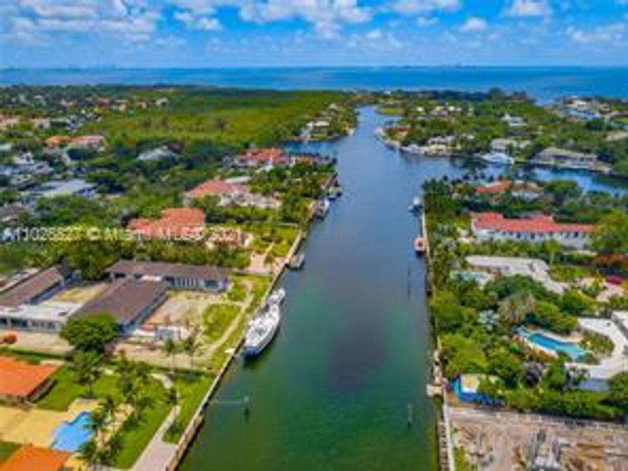This new waterfront resort-style estate is located in one of the most desired communities S Florida, Gables
Estates. The only new single-story home available. Designed by architect Cesar Molina it is a perfect blend of art &function. Front courtyard was designed around a specimen banyan tree now surrounded with a series of connected walkways, water features and living areas. The home is filled with expansive windows, open-concept grand room full of natural sunlight. The sleek chef's kitchen is designed w/ premium finishes and custom built wine wall.Spacious entertaining areas that extends to the covered terrace & outdoor kitchen w/ views of the pool & 200ft of waterfront w/ private dock. The master suite, with waterfront views, features 2 en suite spa-like bathrooms & oversized closets.