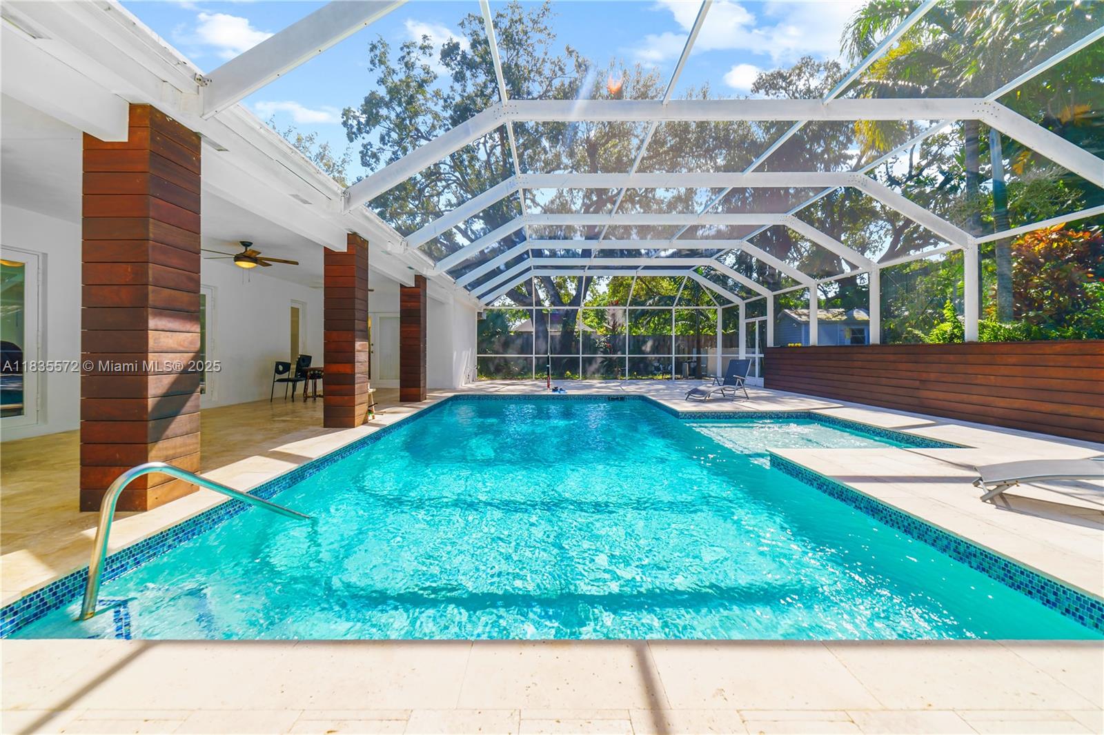 Welcome to this beautifully updated 4-bedroom (two master bedrooms each with direct access to the pool area), 3-bathroom home boasting 2,875 sqft! conveniently situated near Coral Reef Park. This property features extensive improvements, including new air conditioning, complete plumbing, and flooring, along with a remodeled kitchen and a spacious master bedroom. Enjoy peace of mind with a roof scheduled for completion before closing and the convenience of a gas generator. Outdoor highlights include elegant marble flooring, connections for an outdoor kitchen, a dryer, and a gas pool water heater for cost savings. A surround sound system in the master bedroom, mosquito screens for the pool area, impact windows for safety, a salt system in the pool, and an outdoor shower by the pool