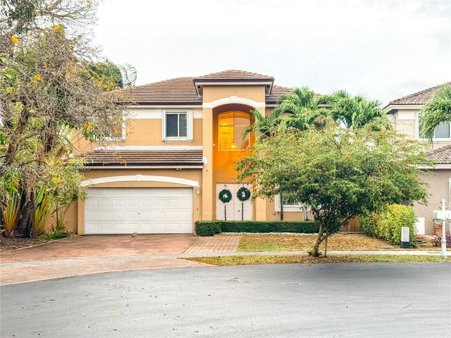 Spacious home with lake view on a large cul-de-sac in a lovely neighborhood. This home has 5 bedrooms, 3 full bathrooms and an extra bedroom/studio area in the converted garage that has a full bathroom. Can be used as in-law quarters with its own entrance. So much storage! Volume ceilings give this home a grand feeling. Roof was replaced in 2022. Impact windows and impact French door. Come update this home with your own personal touches!