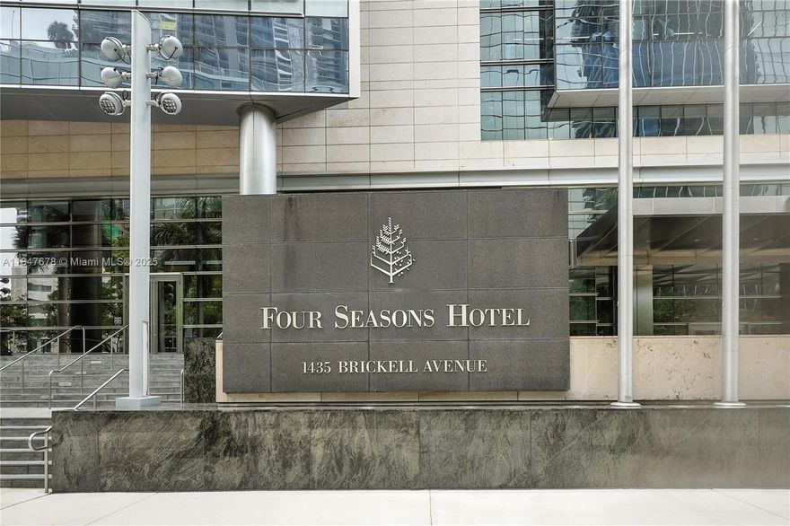 Refined and updated Hotel Condo - Owner wishes to sell! Beautiful and exquisite two bedroom en-suite plus artfully redone powder room. Four seasons' world-class amenities. Equinox Gym, Spa, Pools, 24-hour concierge,  restaurants include poolside cafe and restaurants. Open and Airy!! Lavish modern style! Luxurious master with spa-like bath! Wood floor throughout. Epicurean gourmet kitchen! A joy to entertain in such an elegant and  charming unit with a stunning Miami skyline view and more! Artwork and chandeliers are excluded. Shows beautifully!