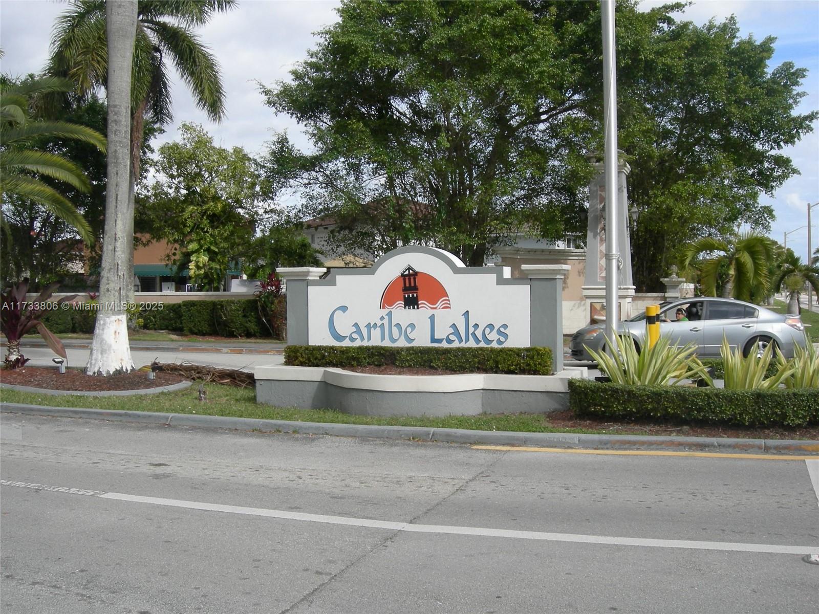 Welcome to this spacious 1,511-square-foot, three-bedroom, two-bath home that offers comfortable living in a secure gated community. The updated bathrooms and sparkling saltwater pool are standout features. At the same time, the kitchen boasts a granite countertop, an elegant backsplash, and brand-new stainless steel appliances, hook up for a washer/dryer. Outdoors, there’s an optional wet barbecue bar, a tiled driveway that accommodates up to seven vehicles, and a two-car tiled garage. Additional highlights include impact windows, doors, garage doors, zebra shades, and four security cameras inside and out. Playground. Stroll along a peaceful lakeside path lined with palm trees and benches, perfect for relaxing and enjoying serene water views. Schedule your showing today,