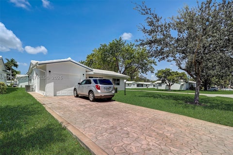Photo of 1651 NW 85th Ave, Plantation, FL 33322 (MLS # A12087906)