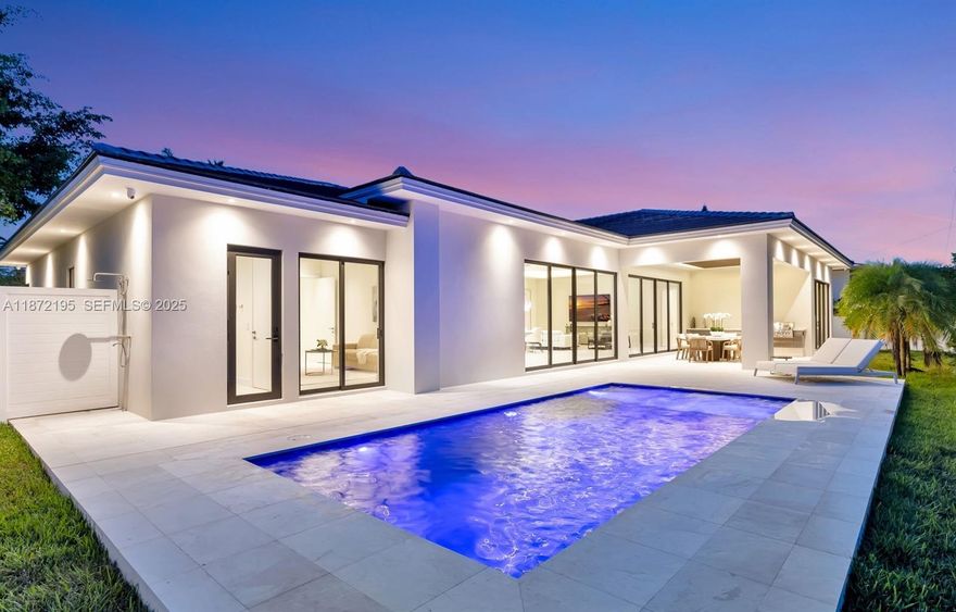 Discover a newly completed furnished custom estate in Coral Ridge Country Club Estates, masterfully designed for both elegance & ease of living. Soaring 12’ ceilings & walls of glass flood the home with natural light, while an 11’ Golden Belly quartz island anchors a chef’s kitchen with Miele Kitchen Suite appliances. Two 16’ sliding glass doors dissolve the boundary between indoors & outdoors, leading to a resort-style pool, jacuzzi, cabana bath & summer kitchen for al fresco dining. The spa-inspired primary suite features a wet room with soaking tub & shower, while three additional suites ensure privacy for guests. 3-car garage with lift potential & a total smart home system complete this rare opportunity to own a true modern masterpiece in one of Ft Lauderdale’s most prestigious neighborhoods.