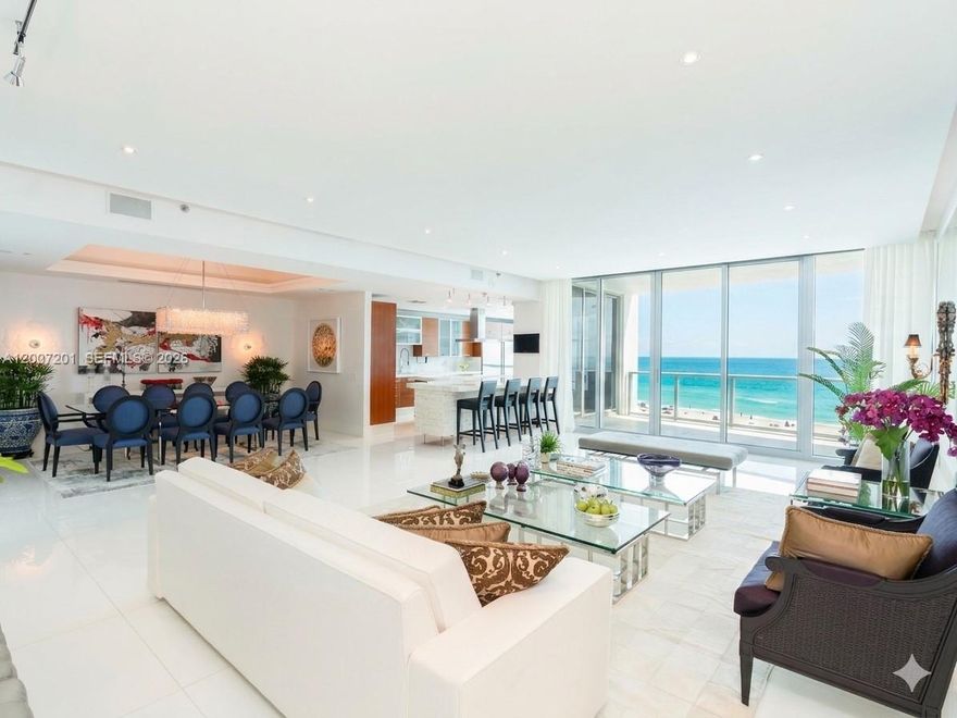 Welcome to Residence 906 at The Bath Club! One of Miami Beach's most coveted addresses on Millionaire's Row. This direct oceanfront residence offers 4,135 Sq.Ft. of impeccably finished living space with 4 bedrooms, 5.5 bathrooms, and sweeping unobstructed  white-sand beach views from every main living area. Soaring 10-foot ceilings and floor-to-ceiling impact glass create a light-filled, resort-caliber atmosphere throughout. The chef's kitchen features custom walnut cabinetry, thick marble countertops and backsplash, Miele built-in espresso machine, stacked wall ovens, professional induction cooktop island, and Sub-Zero refrigeration. A dedicated media/family room showcases a 120-inch screen projector with ambient lighting and integrated in-ceiling surround sound. The oceanfront terrace is ideal for entertaining. Full designer furniture package included, true turnkey/move-in ready delivery. Residence includes two assigned parking spaces. Situated within a gated 5.3-acre enclave featuring 540 feet of pristine Atlantic Ocean beachfront, The Bath Club offers 5-star amenities: private beach service, resort pool, clay tennis courts, health spa, valet, 24-hour security, concierge, and in-residence dining. The "06" line is one of the most sought-after floor plans in the building. A rare opportunity to acquire one of the largest, best-finished residences at the prestigious Bath Club.