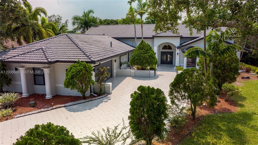 Experience luxury living in this stunning 7-bedroom, 5-bath estate located in the heart of Plantation. Perfect for both everyday comfort and entertaining, this expansive home features a state-of-the-art game room, spacious living areas, and a private pool surrounded by lush landscaping. The gourmet kitchen is equipped with high-end appliances and elegant finishes, ideal for those who love to cook and gather. Just minutes from Fort Lauderdale’s beautiful beaches, fine dining, and shopping, this exceptional property offers the perfect balance of tranquility, convenience, and timeless sophistication.