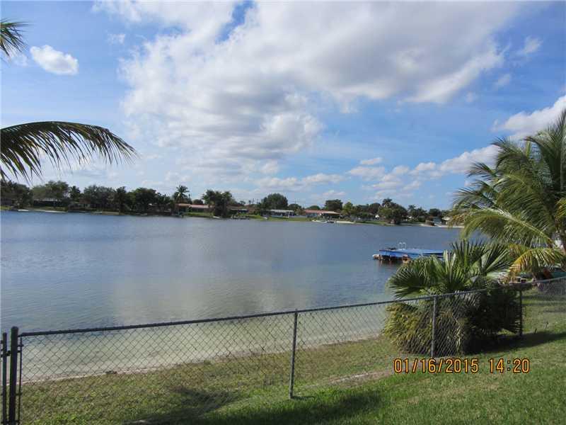 Breathtaking, direct water view. Motorboats & jet skis allowed. Beautiful, updated house on Blue Lake. It features impact windows, newer roof, A/C, bathrooms, tile & wood floors & refrigerator all replaced within the last 2-3 years. Laundry in garage. Ala rm system.