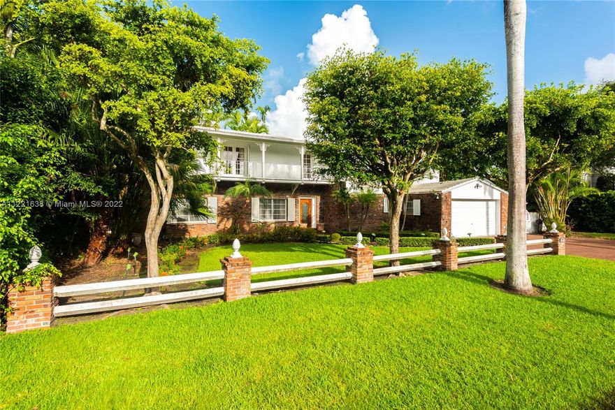 Grand home on exclusive La Gorce Island. This stately 5 bedroom 2 story home boasts a perfect layout.  Featuring an elegant foyer entry leading to spacious living room with fireplace, oversize family room with built-in wet bar, formal dining room, and eat-in kitchen, are all part of the timeless design and architectural allure. Envious floor plan with 4 bedrooms and 4.5 baths upstairs, featuring a large principal suite with his and hers bathrooms, ample closets, and private access to oversized balcony. Impressive garden and grounds with private patio and room for a pool. Full house generator, 2 car garage, and separate laundry room. Great location, great lot, great potential. Square footage living area per appraisal is 4,098.