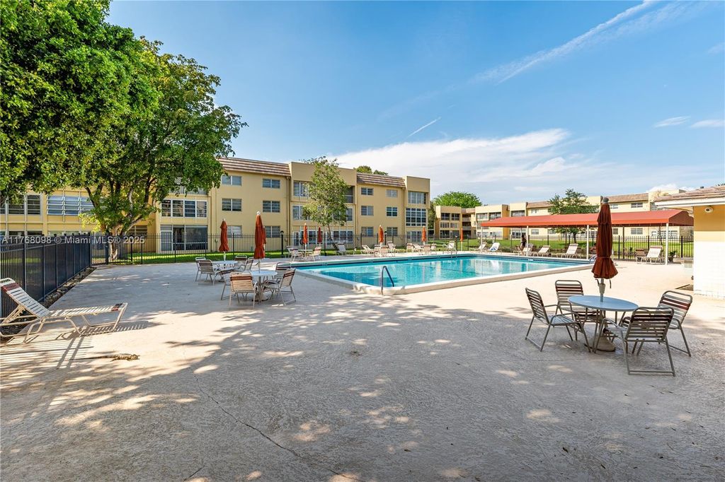 Photo of 5860 NW 64th Ave #302, Tamarac, FL 33319 (MLS # A11768098)