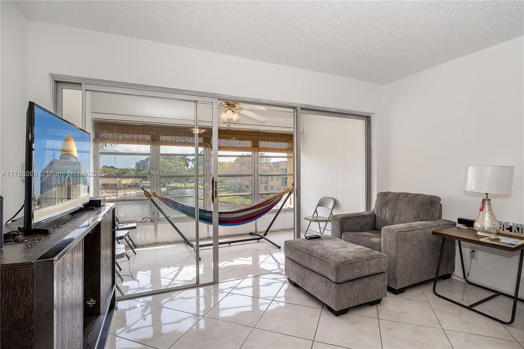 Photo of 5860 NW 64th Ave #302, Tamarac, FL 33319 (MLS # A11768098)