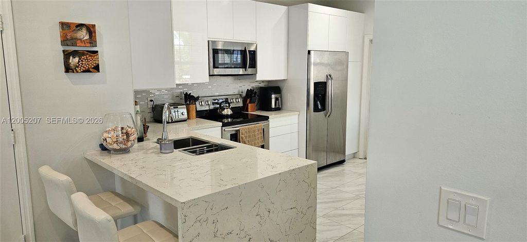 Photo of 1844 Salerno Cir #1844, Weston, FL 33327 (MLS # A12005207)