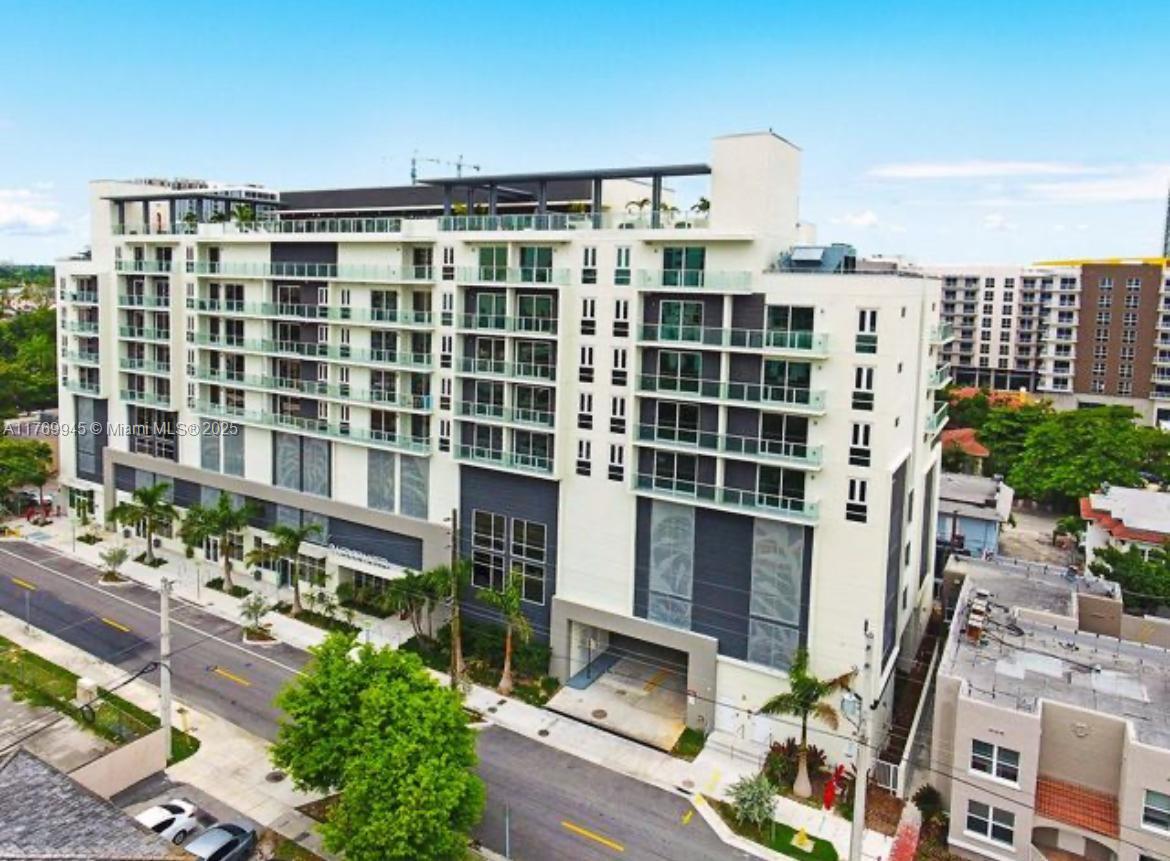 Move right into this modern 1-bedroom, 1-bathroom condo at 26 Edgewater, a contemporary building in the heart of Miami. Just steps from Wynwood, Midtown, and the Design District, this unit features a cool, misty gray laminate flooring, stainless steel appliances, European-style kitchen and bath, and an in-unit washer & dryer. Floor-to-ceiling windows fill the space with natural light, complemented by stylish furniture and contemporary artwork. Building amenities include: a rooftop pool, gym, clubhouse, and office complex. Quick condo association approval for qualified applicants. Easy to show—call the listing agent today!