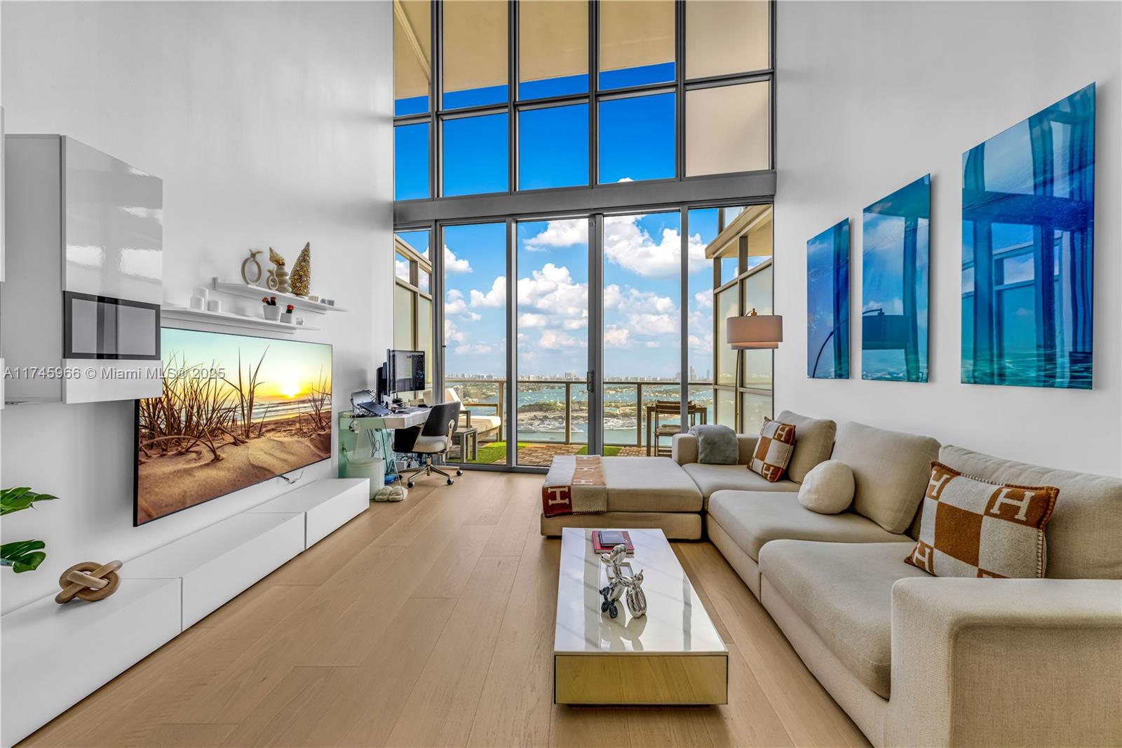 Elevate your lifestyle in one of Miami’s most prestigious buildings, offering stunning views of Biscayne Bay, the Atlantic Ocean, and downtown. Soaring 43 stories high, this nearly 1,700 SF loft features 20’ ceilings and an oversized balcony. The 1-bedroom + DEN includes two renovated bathrooms and custom closets. Enjoy world-class amenities at Marquis, including a bayfront pool, fitness center, spa, and a half-court basketball. Located in the heart of Miami, you’re steps from Pérez Art Museum, Frost Science, Kaseya Center, and Miami Worldcenter. The future Signature Bridge Park will add 33 acres of green space. With easy access to the Design District, Miami Beach, Brickell, and Wynwood, this residence is a statement of modern luxury. Beach club access included at Bentley Hotel.