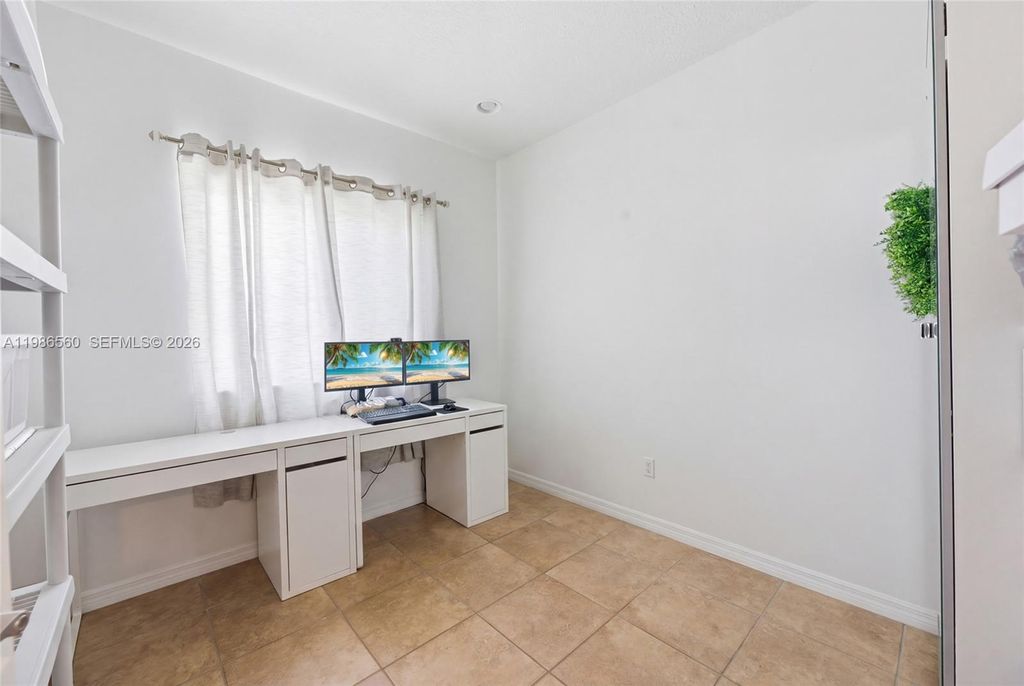 Photo of 5918 Woodlands Blvd, Tamarac, FL 33319 (MLS # A11986560)