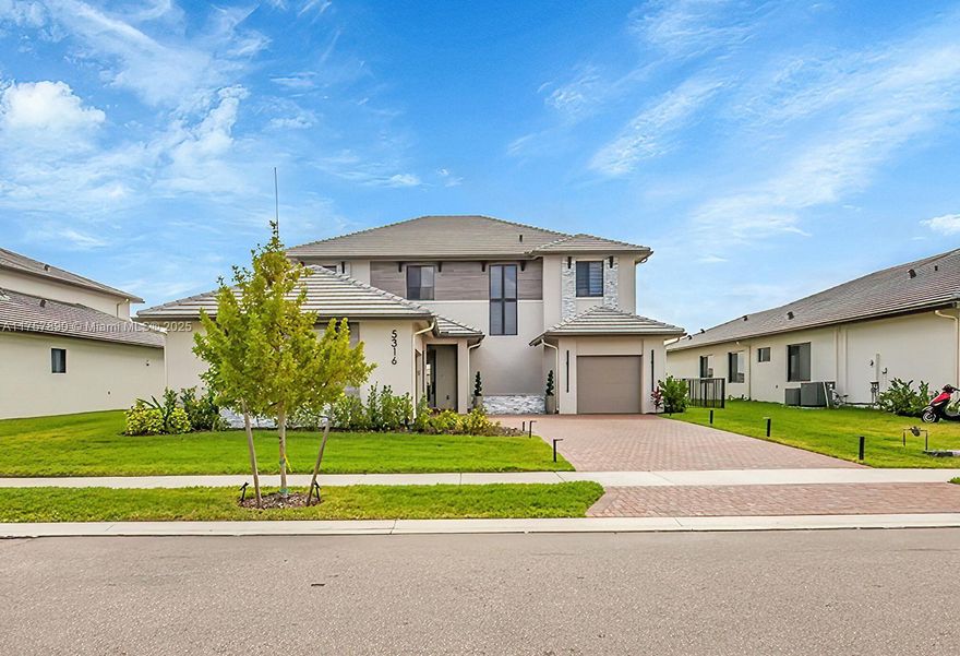 Welcome to 5316 Marano Drive, breathtaking 4-bed, 3.5-bath single-family home in the highly sought-after Maple Ridge community of Ave Maria, FL. This 3,985 sqft residence sits on an oversized lot with stunning lakefront views, offering the perfect combination of luxury, space, and convenience.
Step inside to an open floor plan designed for modern living, with high ceilings and abundant natural light. The gourmet kitchen features premium appliances, ample cabinetry, and a large island, seamlessly flowing into the living and dining areas- perfect for both entertaining and everyday living. The loft features a custom design with floating shelves mounted on the walls. The massive master suite is a true retreat, boasting his and hers custom  built-in closets. Furniture is included in sale.