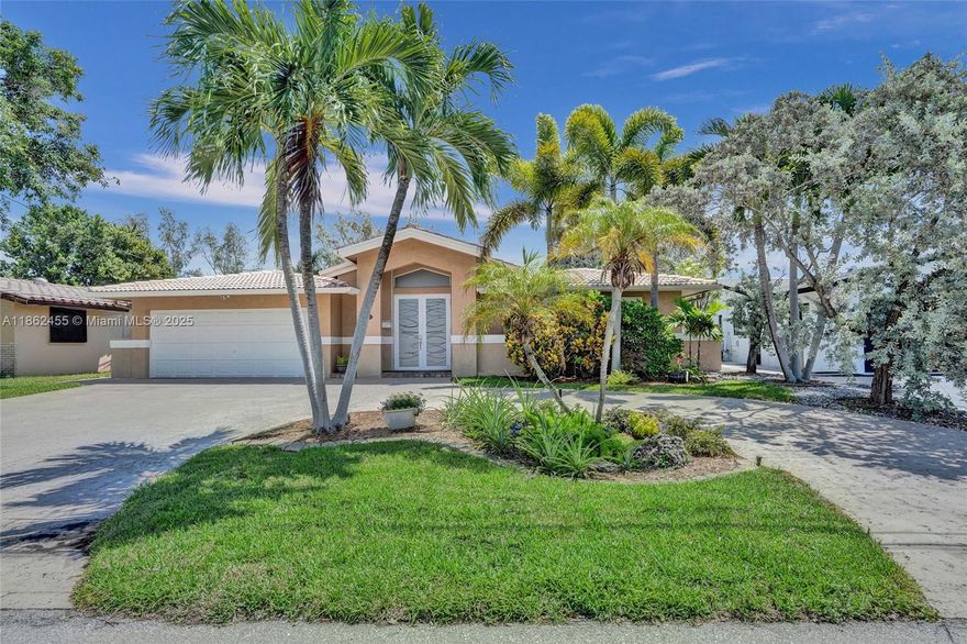 Waterfront Boaters Paradise with only one fixed bridge to the Ocean! Beautifully updated canal-front home features include tile flooring in main areas, vaulted ceilings, knockdown textured walls/ceilings, & crown molding. Chef’s kitchen with Stainless Steel appliances- Sub-Zero fridge, Wolf double oven, microwave/confection, center island, extra icemaker & wine cooler. Spacious bedrooms all with large closets, updated bathrooms including cabana bath for convenience in/out to the pool.  Step outside to your backyard Oasis- oversized patio, heated saltwater pool with waterfall, paved deck, custom tiki bar w/ grill, 70’ dock with water, electric, shower & 14,000lb Neptune boat lift, dock  
Circular driveway& Fenced yard, this home is move-in-ready—perfect for year-round waterfront living!
