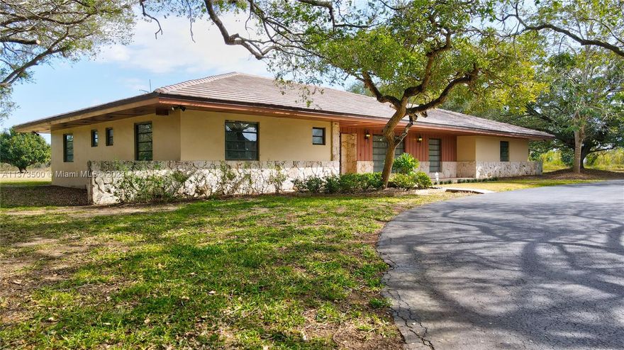 Location, location! Well built CBS home with flat tile roof. Beautiful street presence. Over 3000 plus sq ft hpme on 20 acres gross. Property has a large detached CBS garage and a second CBS equipment garage. Well maintained  home by one of the original Homesteaders of the area. Located in the Redlands. Excellent location, in desirable Redlands north quadrant, and minutes from US-1. Easy in and out, located on the corner of SW 248th St., "Coconut Palm", and SW 157th Av. "Newton". Rare opportunity for home and agricultural business. Large property that can be subdivided into 4 lots. Avocado/mango grove gives you income and agricultural status for taxes. The Redlands, Florida's last frontier, south Florida's last Agricultural land area. Located between the Florida Keys and greater Miami.
