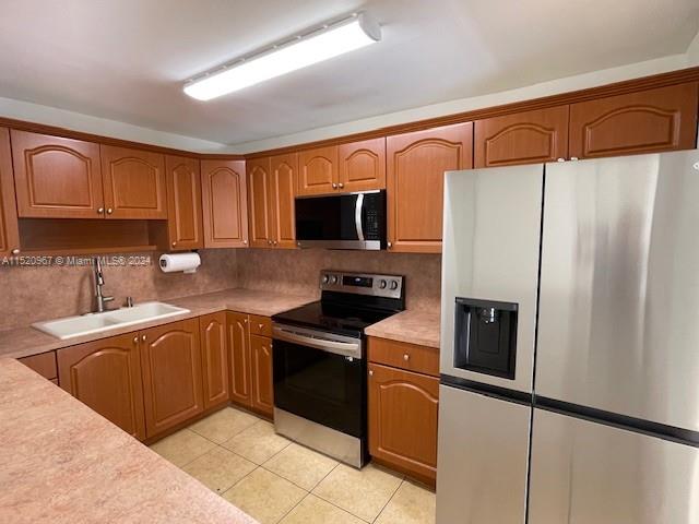 Immaculate! Beautiful 2 bedroom and 2 bath unit at Kendall Acres. This unit faces the pool and canal. Spacious living areas, open kitchen, large closets and tile floors throughout. Stainless Steel Appliances, plenty of cabinets and bright and airy.  Freshly painted!  Fantastic location close to shopping, dining and entertainment.  Balcony with storage closet. Hurry don't delay this one will go fast.