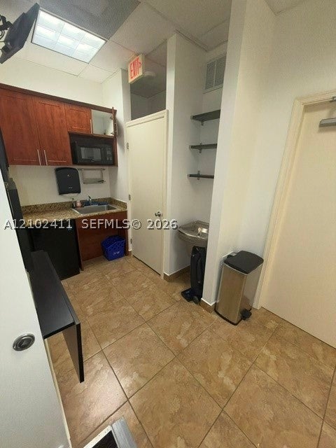 7501 Wiles Road 102-A
