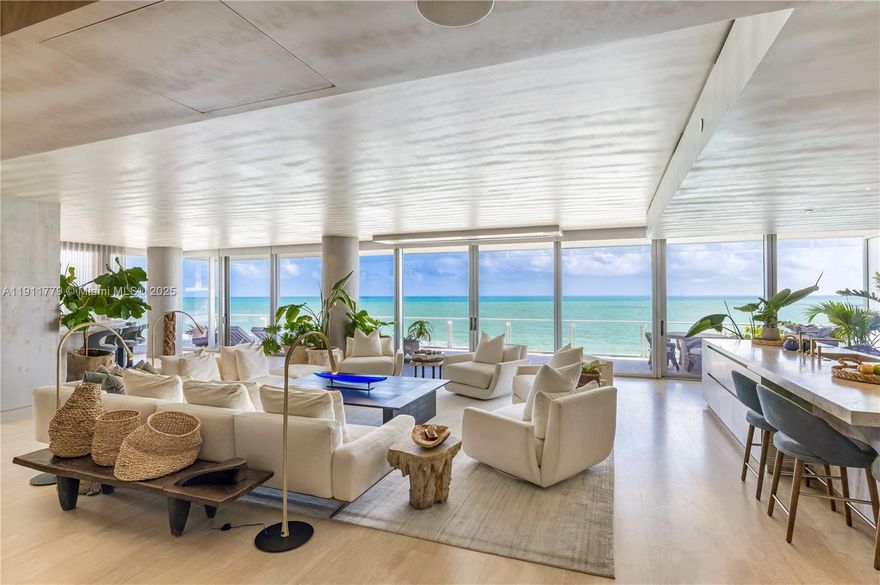 Experience the ultimate in oceanfront living at The Four Seasons Residences Surf Club, where 5,321 SF of oceanfront elegance awaits. This 4 bedroom masterpiece, reimagined by Greenauer Design Group, features an expansive great room opening to over 60ft of stunning oceanfront views, complemented by more than 2,000 SF of wrap-around terraces. Each bedroom serves as a private suite, offering a sitting lounge & direct balcony access. Offered fully furnished, this residence showcases bespoke designer details, including a custom eggersmann kitchen and vanities in Taj Mahal leathered quartzite, brushed white oak cabinetry, travertine tubs carved from single blocks, heated bathroom floors, Miele, Wolf, & Sub-Zero appliances, opalescent ceiling finishes, & a custom-designed wet bar.