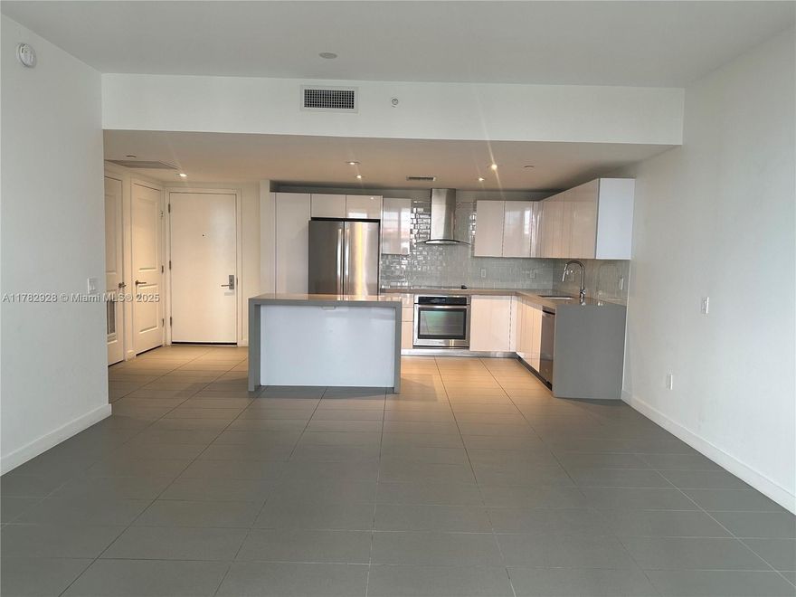 Experience modern urban living in this spacious 1-bed, 1-bath residence at Canvas Condo, located in Miami’s vibrant Arts & Entertainment District. This unit features floor to ceiling impact windows, an open kitchen with Italian cabinetry, quartz countertops, and stainless steel appliances, plus a generous private balcony. The oversized bathroom includes a soaking tub and sleek, contemporary finishes. Canvas offers resort-style amenities: 3 pools, a full-service fitness center, spa, racquetball court, yoga garden, media room, business center, and 24/7 concierge. Unbeatable location—minutes from Wynwood, Design District, Downtown, and Miami Beach. Pet-friendly building with valet and assigned parking. Ideal for end-users or investors—short-term rentals allowed (30-day minimum).