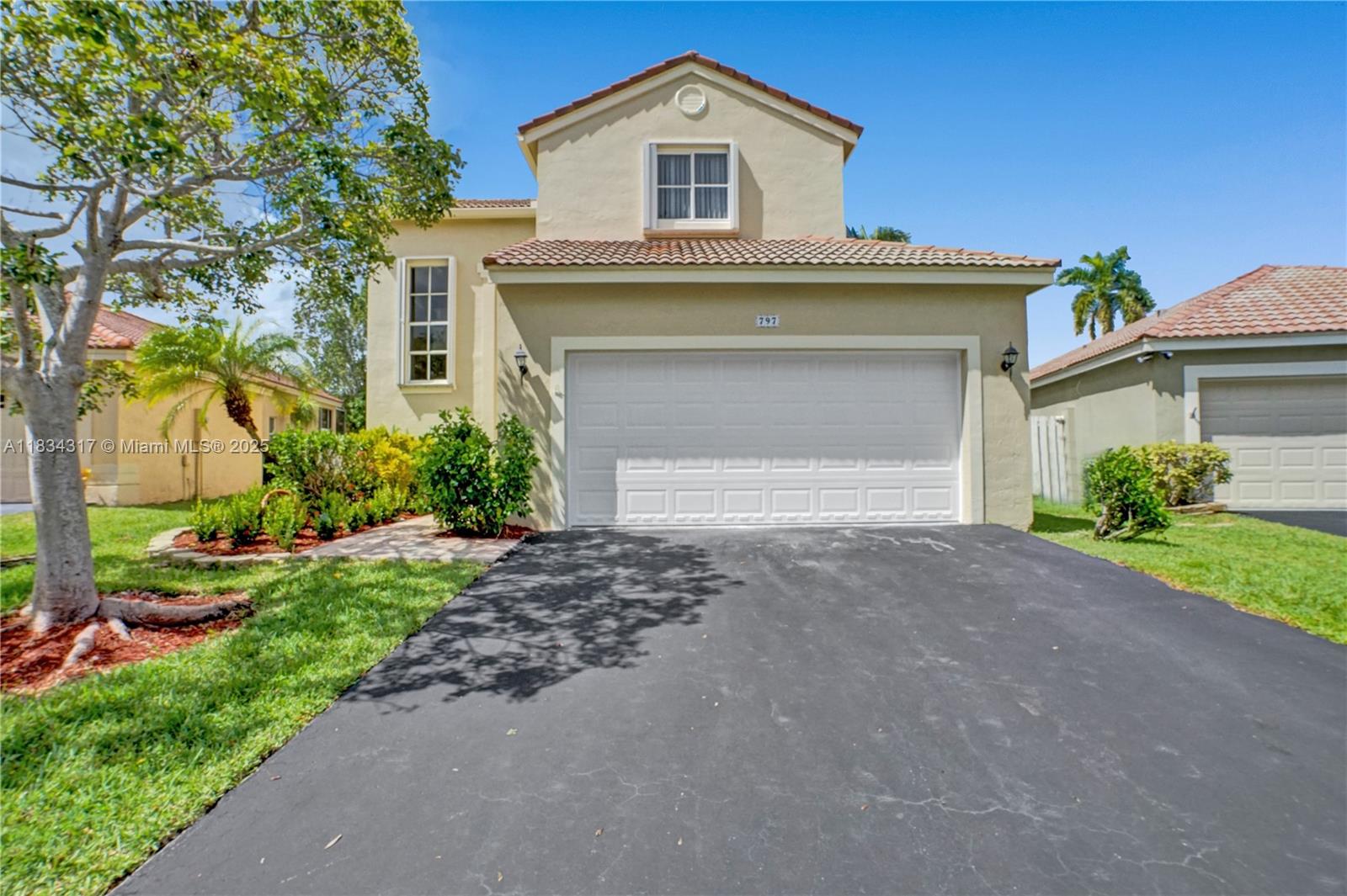 **Welcome to The Falls, one of Weston’s most sought-after family communities!**
This stunning cul-de-sac home features a **brand-new roof (2025)** and is zoned for top-rated A+ schools. Boasting 5 bedrooms, it stands out as the best-value 5-bed home in the area, spacious,updated, and competitively priced. Enjoy a **heated, screened-in pool**, paver patio, and extended covered lanai ideal for outdoor living. Inside, discover California closets, crown molding, French doors, and a primary suite on the main floor. Tile floors downstairs,wood upstairs,accordion hurricane shutters,fresh neutral paint,newer landscaping, and a renovated kitchen with new appliances add to the charm.Located in a family-oriented community, it's just steps to elementary school and near middle/high school bus stops.
