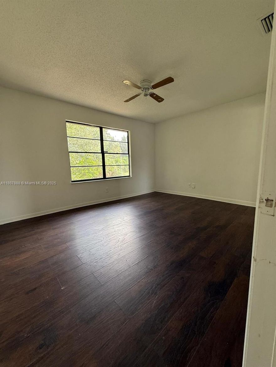 This two-story townhouse in the vibrant heart of West Palm Beach, With tile floors on first floor, well equipped kitchen featuring stainless steel appliances contemporary Cabinetry, one and a half bath for guests and small backyard or patio, Upstairs, you will find two bedrooms and bath. This townhouse combines  privacy and comfort.