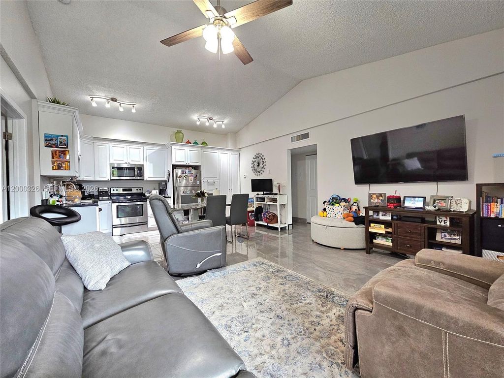 Photo of 841 Lyons Rd #24205, Coconut Creek, FL 33063 (MLS # A12000326)