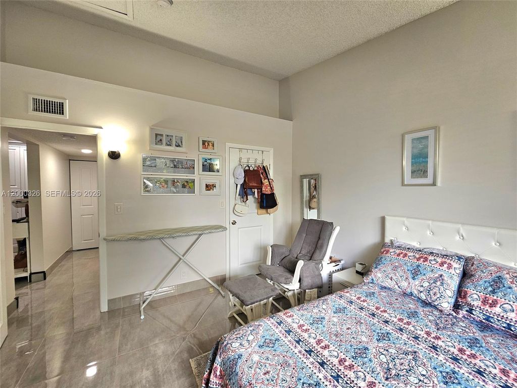 Photo of 841 Lyons Rd #24205, Coconut Creek, FL 33063 (MLS # A12000326)