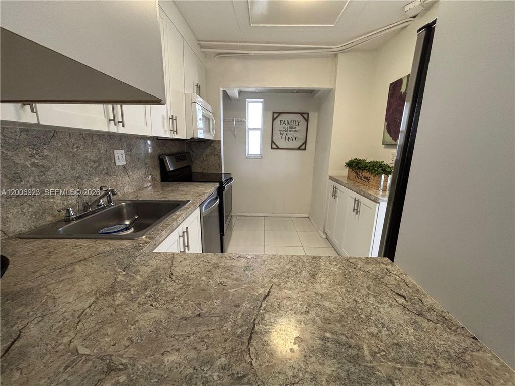 Photo of 8060 Fairview Dr #101, Tamarac, FL 33321 (MLS # A12006923)