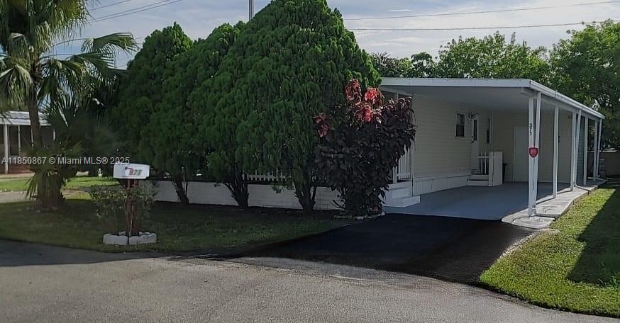 Wahoo! BEAUTY MANUFACTURED HOME IN PLANTATION. Great location. OWN YOUR OWN LAND, double wide, CAN BE RENTED IMMEDIATELY, freshly painted 2 bed 2 bath, you can make 2 more rooms in the front, easy requirement see Building department plantation, painted roof, new laminate flooring, screen patio, carport, 3 Parking Space , private back fence, storage, the property there are some beautiful pine trees, palms that give privacy to the house and the screened patio area. This community is for ALL AGES. $65 a month No HOA APPROVAL, Few Minutes from Sawgrass Mall, Ikea, theater, shopping, restaurants, excellent schools, get direct into 595, Sawgrass Express Highway close to Everything Easy to show with proof of funds just cash, hard money loan Lender or conventional available with 20% down payment.