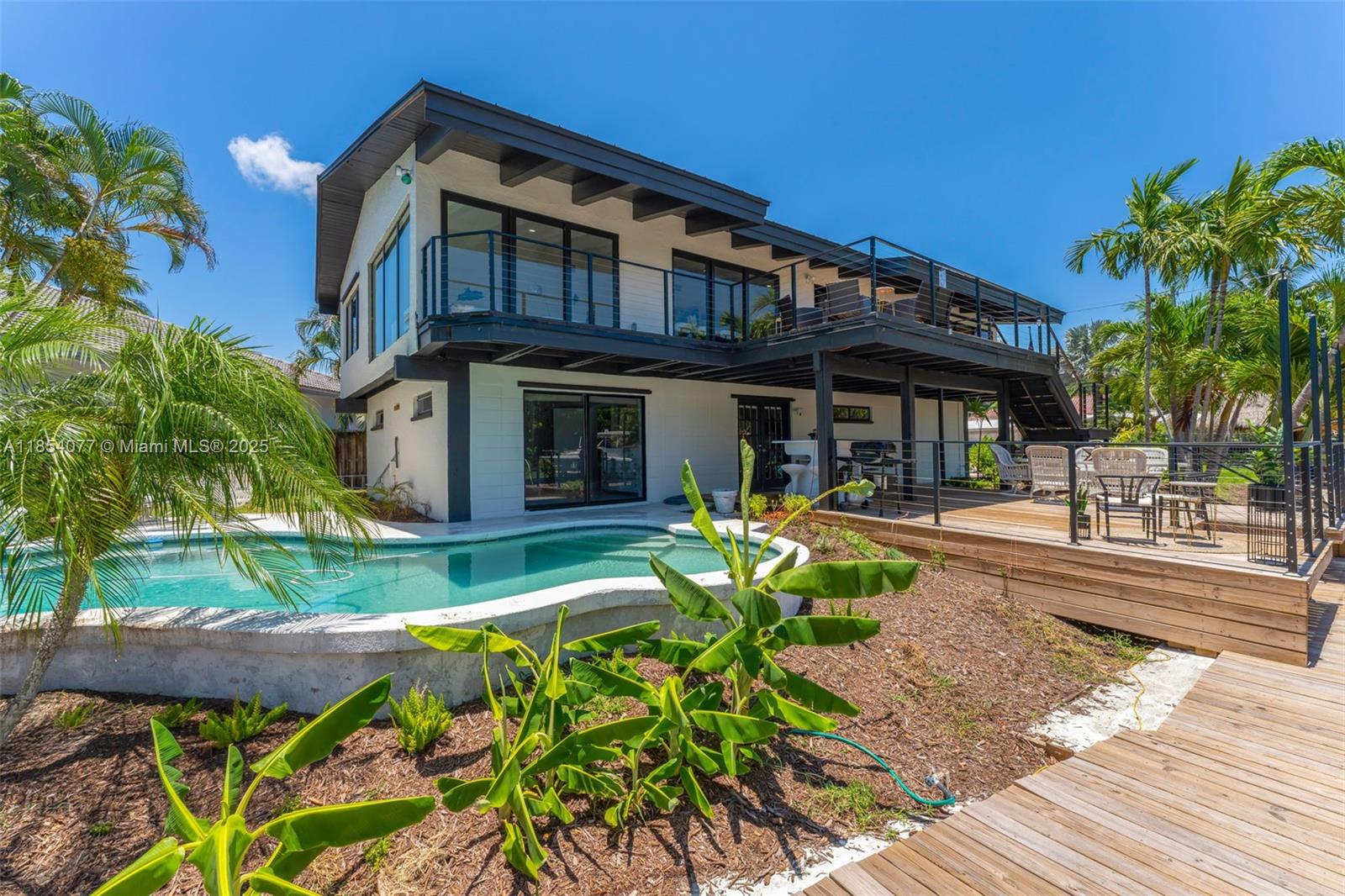 Experience Coastal Living at its finest in this Waterfront Pool Home, featuring 5 bedrooms, 4.5 baths, with Private Dock Space 130 Feet long enough for multiple boats and all your water toys. Spacious and beautifully remodeled. New Roof, Impact Windows throughout, upgraded deck, and high-end finishes. The upstairs has the primary suite with en-suite bath, walk-in closet, and private balcony, two additional bedrooms with ample
storage, and Modern bathrooms with updated finishes. Downstairs features additional living space and a guest suite. Great location just minutes from Deerfield Beach, Fishing Pier, Scenic parks, Shops, and Restaurants.