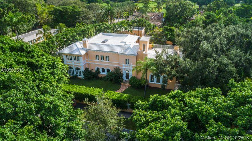 Located on iconic Alhambra Circle, this enchanting 1929 Coral Gables estate offers elegant living with Mediterranean Revival style architecture and hasn&#x2019;t been offered for over 50 years! The gated triple lot offers 22,500 sf offers privacy, a picturesque oak tree, oversized 40-foot-long pool, & spectacular rooftop terrace.  Inside, the updated home designed by Anthony DeH Zink, has preserved historic features such as Cuban tiles, original hard wood floors, two fireplaces, arched windows & hallways, high ceilings & French doors throughout. Main house 5 large bedrooms, 4.5 baths, sunroom, formal living & dining, elevator, impact windows and living rooms both upstairs & downstairs. The detached structure has a dedicated room for a wine cellar, gym, additional room & upstairs 1/1 guest house.