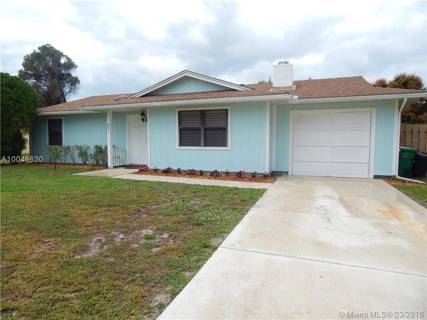 Lovely Key West Style 3/2 Cottage in Port St Lucie, with a working fireplace and converted garage, spacious yard with large shed for additional storage, ceramic tile flooring throughout living area with wood flooring in bedrooms, upgraded kitchen with stainless steel appliances, extra large separate freezer in Laundry room. AC is 6 months old. No HOA. Off Gatlin very close to Tradition.