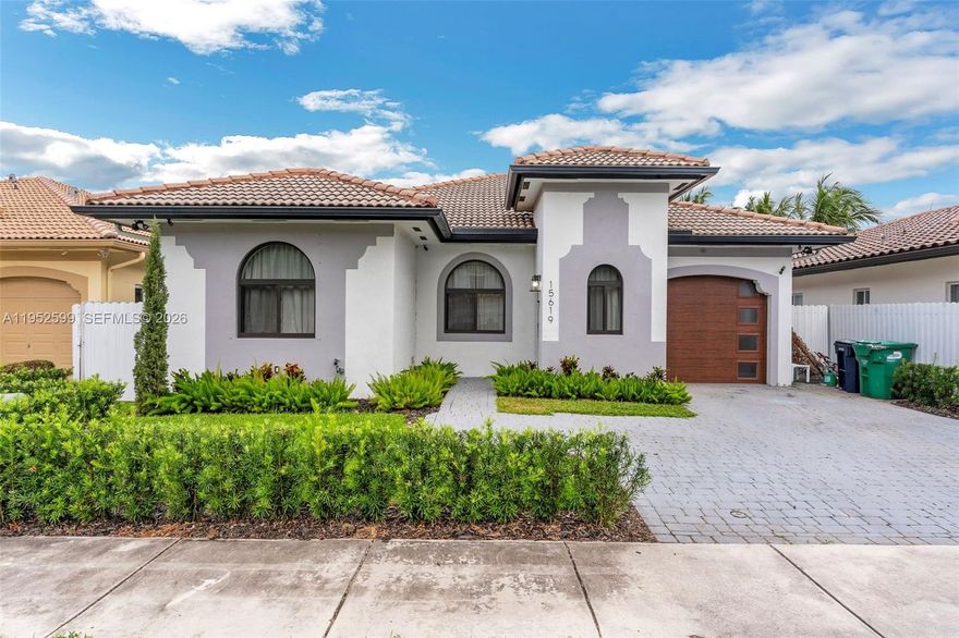 Discover your perfect home! Meticulously remodeled, the state-of-the-art kitchen boasts high-end Miele appliances, sleek cabinetry, and gorgeous quartz countertops. Soaring ceilings enhance the open, airy feel, while brand-new tile flooring adds sophistication throughout the home. Retreat to the serene bedrooms, each featuring custom high-end closets for optimal organization. Impact windows and doors provide safety and energy efficiency, adding to the home’s stylish appeal. The professionally landscaped front and back yards offer a lush, inviting environment. Every detail of this home has been thoughtfully designed to enhance your lifestyle. Experience the perfect harmony of beauty and functionality in a residence that truly has it all.