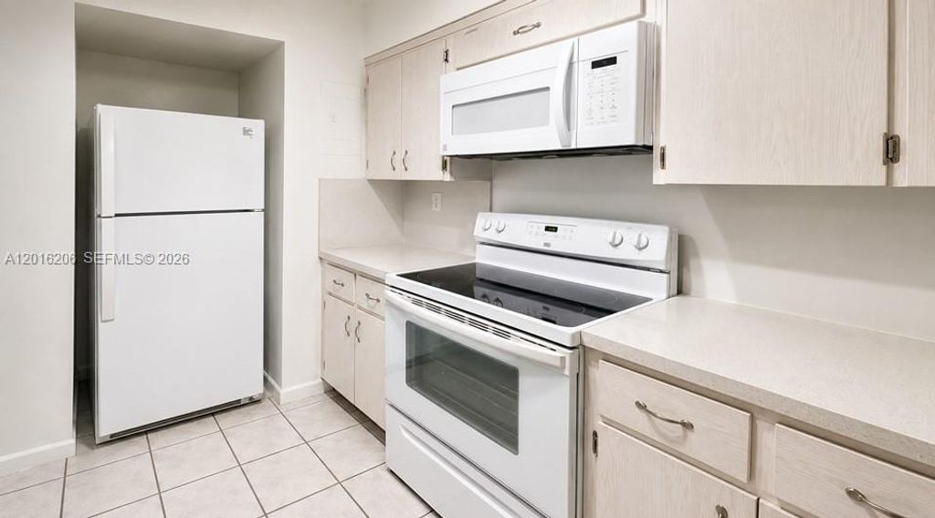 Photo of 9150 NW 38th Dr #301, Coral Springs, FL 33065 (MLS # A12016206)