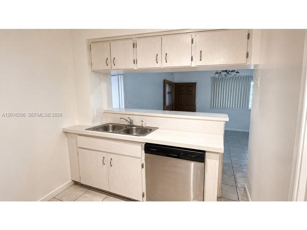 Photo of 9150 NW 38th Dr #301, Coral Springs, FL 33065 (MLS # A12016206)