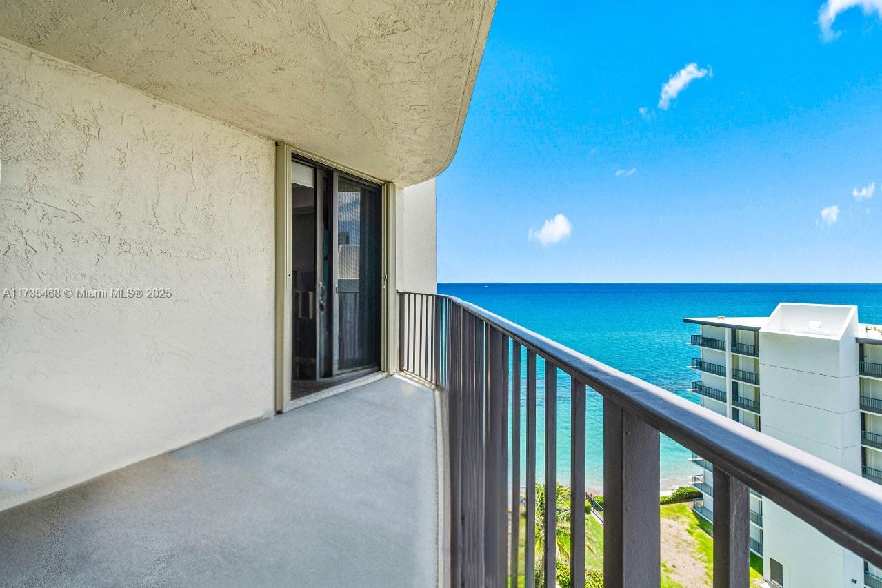 Breathtaking ocean sunrises & unwind with serene Intracoastal sunsets from this highly sought-after Singer Island corner unit. Open-concept layout features floor-to-ceiling windows, filled with natural light and panoramic water views. Enjoy an expansive wraparound balcony, perfect for coffee at sunrise or cocktails at sunset. Kitchen boasts granite countertops, custom wood cabinetry, stainless steel appliances, & a breakfast bar. Primary suite offers private balcony access & stunning water views. Ocean-facing second bedroom makes an ideal guest retreat or office. Impact windows and concrete restoration. This boutique-style building offers a heated pool, beach access, fitness center, & proximity to marinas, Phil Foster Park, & Peanut Island. Move-in ready, delivers luxury, tranquility.