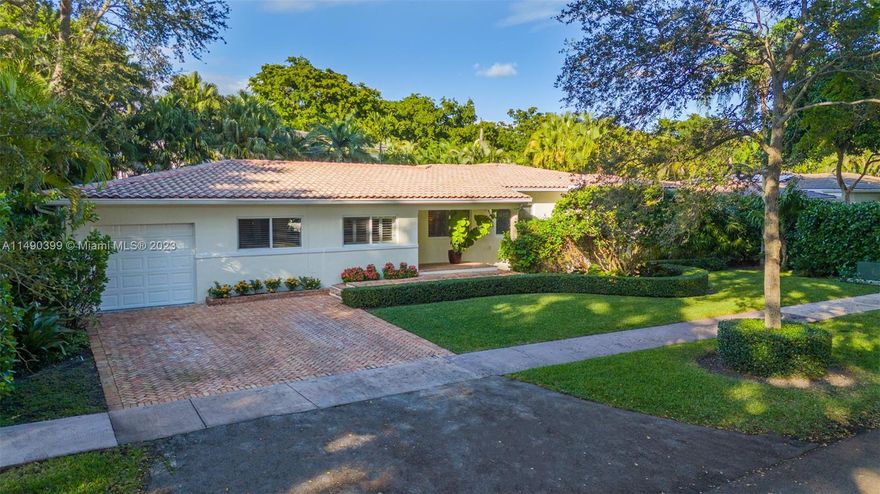 Welcome to 527 Savona Ave, a perfectly located Coral Gables gem on a lush 10,000 sq ft lot. This meticulously maintained 3-bedroom + den, 2-bathroom home exudes timeless elegance. The spacious floor plan seamlessly connects the living, dining, and kitchen areas, creating a perfect space for both entertaining and everyday living. Enjoy the Florida sunshine in your private backyard oasis, complete with a sparkling pool and lush landscaping. Additional features include hardwood floors, impact windows/doors, covered patio, 2022 A/C and walk-in closet in the primary bedroom. The attached garage provides convenience, while the proximity to local amenities and A-rated schools enhances the appeal of this Coral Gables residence.