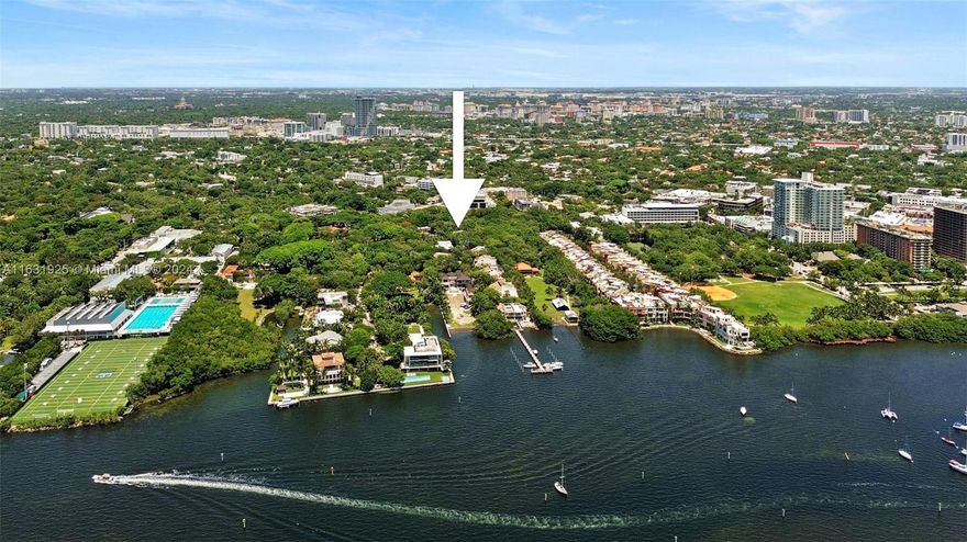 Rarely available, this 3-bedroom, 3.5-bath townhome is located in Abitare, an exclusive waterfront gated community in historic Coconut Grove. This enclave blends natural beauty with luxurious living, set within a serene hardwood hammock overlooking Biscayne Bay. The home features an elegant solid wood staircase and an elevator, leading through four light-filled floors with numerous windows and skylights. The open layout includes a spacious kitchen with an island, dining room, living area, and den. The primary suite offers two en-suite baths, a walk-in closet, and garden views. Two generous guest rooms share a bath. Nearby, the private community dock offers a place for your boat and stunning views of Biscayne Bay and Coconut Grove marina.