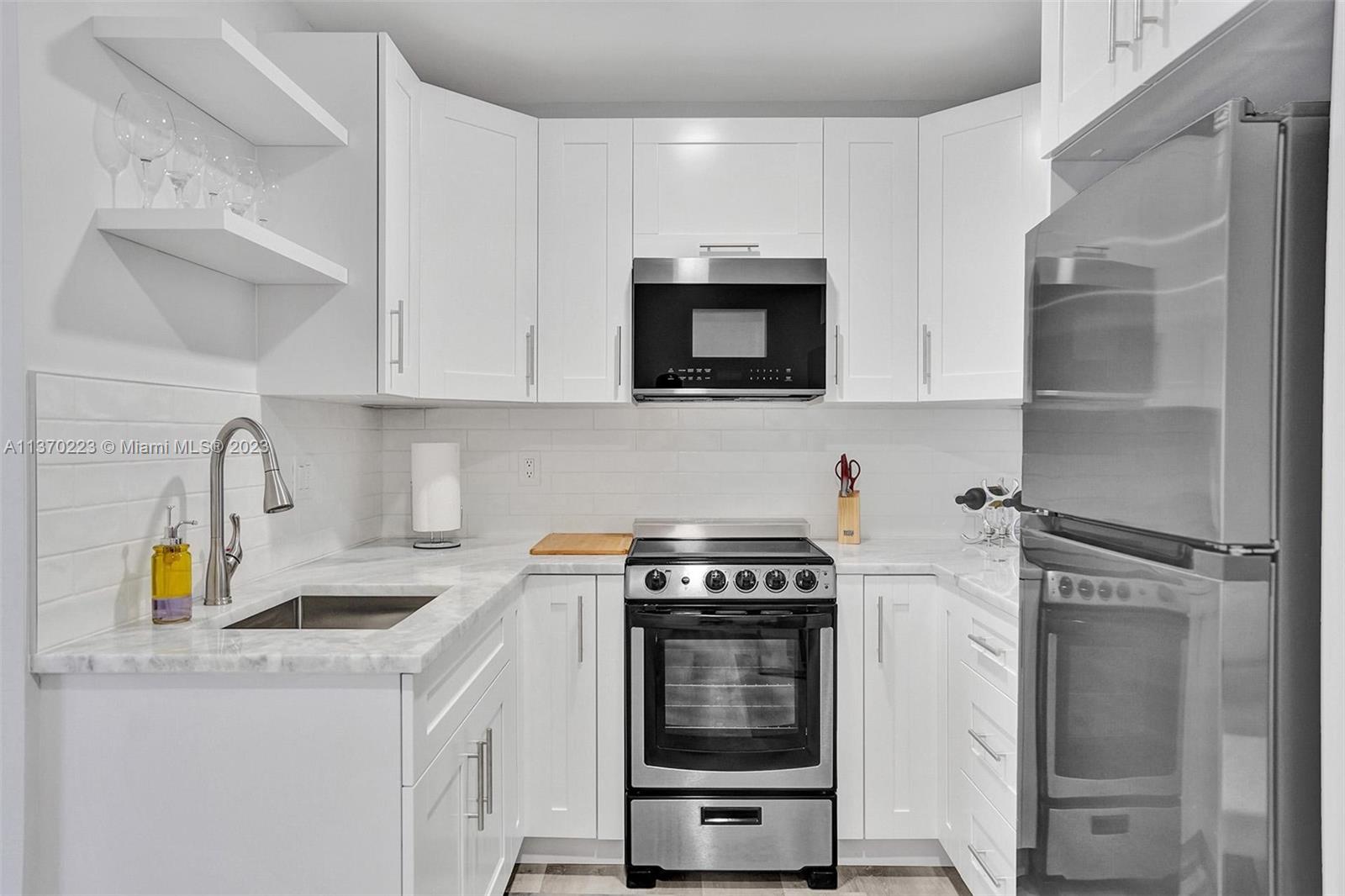 IMMACULATE! Fully remodeled massive studio for sale in the heart of the desired Hollywood Downtown FL. The property features spectacular golf course views, high ceiling, and large balcony. The customized kitchen features granite countertop, fancy cabinetry, and new stainless-steel appliances. Well redone bathroom w/ porcelain tile, high end fixtures, glass shower, and modern lights. The studio has waterproof vinyl flooring throughout, a new plumbing system and electrical panel, new HVAC, and high impact door. Located within 5 minutes’ walk from beautiful downtown Hollywood, you must see it! The unit is being sold with brand new furniture! Only 10 minutes’ drive from FTL Int Airport and beach. Rare seller financing option! Bring your toothbrush and enjoy the Florida Lifestyle! Call now!