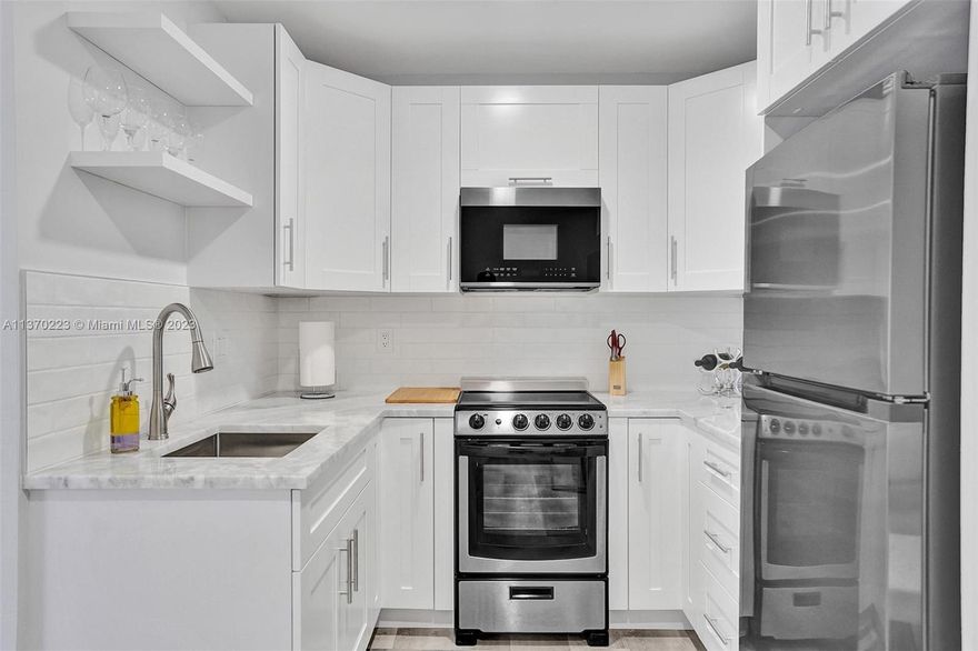IMMACULATE! Fully remodeled massive studio for sale in the heart of the desired Hollywood Downtown FL. The property features spectacular golf course views, high ceiling, and large balcony. The customized kitchen features granite countertop, fancy cabinetry, and new stainless-steel appliances. Well redone bathroom w/ porcelain tile, high end fixtures, glass shower, and modern lights. The studio has waterproof vinyl flooring throughout, a new plumbing system and electrical panel, new HVAC, and high impact door. Located within 5 minutes’ walk from beautiful downtown Hollywood, you must see it! The unit is being sold with brand new furniture! Only 10 minutes’ drive from FTL Int Airport and beach. Rare seller financing option! Bring your toothbrush and enjoy the Florida Lifestyle! Call now!