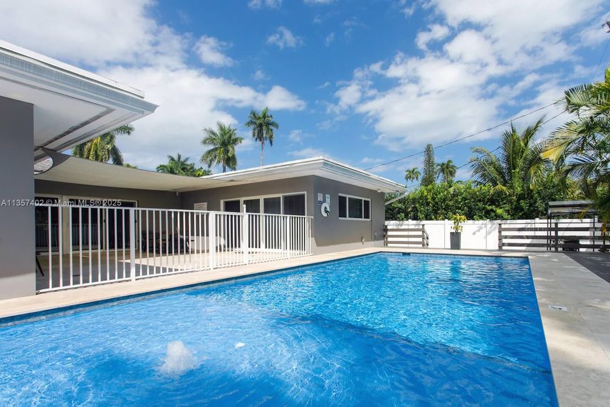 This is a short term Monthly/Weekly Rental******Monthly rate  $12,500****Call agent for a Weekly Rent Price***
Fully Renovated, Impressively Beautiful, Luxury 5BR/3BA Villa with the New Heated Pool.  Located in the Hollywood Lakes and only 1 mi or 15-20 minutes WALK from the famous Hollywood Beach & Boardwalk and minutes from Restaurants, Bars, Casinos, and more...