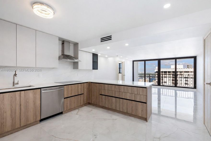 Fully remodeled penthouse 2-bedroom with a desirable split floor plan and top-to-bottom European designer finishes. Oversized tile flooring runs throughout, complemented by modern LED lighting. The kitchen features quartz countertops and full quartz backsplash, paired with modern, elegant cabinetry and high-end fixtures. Bathrooms are equally refined with premium finishes and thoughtful design details. The expansive balcony is a standout feature, offering access from both the living room and the primary bedroom – ideal for seamless indoor-outdoor living and enjoying the oceanfront setting. Every detail has been carefully curated, creating a polished, move-in-ready home that feels elevated and timeless. Perfectly positioned directly on the beach in Hollywood, Quadomain offers quick access to Aventura, Sunny Isles, and Fort Lauderdale, with shops, dining, cafes, and the Hollywood Broadwalk just moments away. The Quadomain complex provides full-service, resort-style amenities including two beachfront pools, two fitness centers, sauna, on-site restaurant, beach service, valet, and 24/7 security – all designed for a smooth, effortless lifestyle. This 2-bedroom layout is ideal for oceanfront living with convenience and services in place. A strong option for buyers who value location, amenities, and direct beach access in the heart of Hollywood.