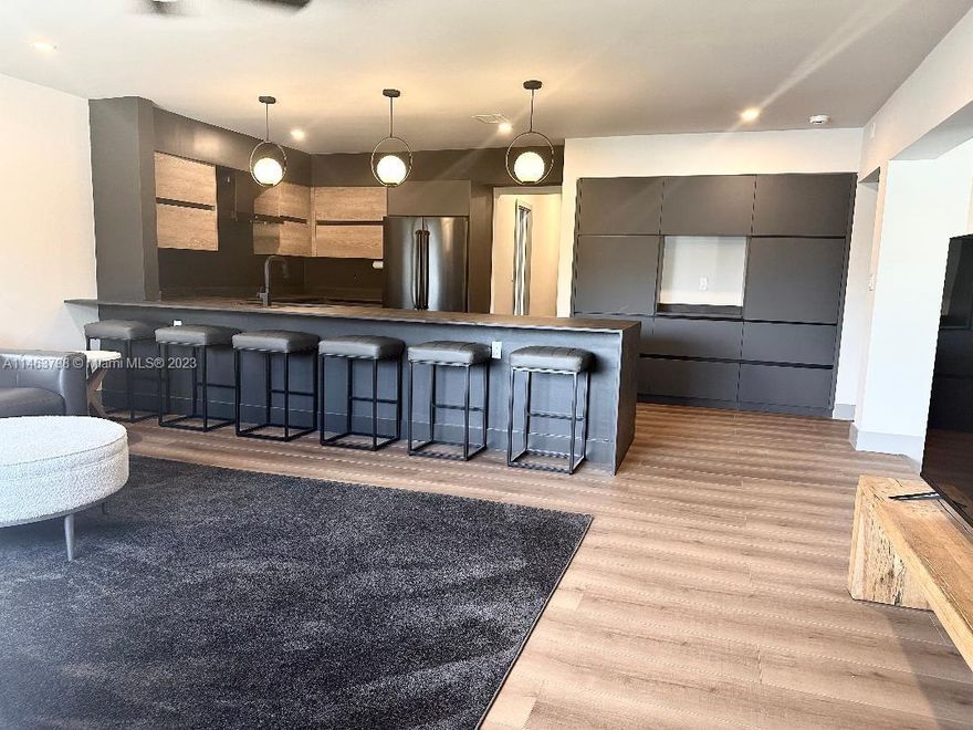 Beautifully remodeled waterfront pool home in beautiful Wilton Manors. Situated at the end of a very private cul-de-sac. Oversized point lot with a wide river view allows for a boat and/or wave runner. Only two tall fixed bridges to open water. Two car garage with electric car charger, with a storage room for tools and yard equipment. 
Inside feature 3 bedrooms and 3 baths, entry, dining area, formal living area with wet bar, laundry room, and a large kitchen/Family room that overlook the tranquil water setting.