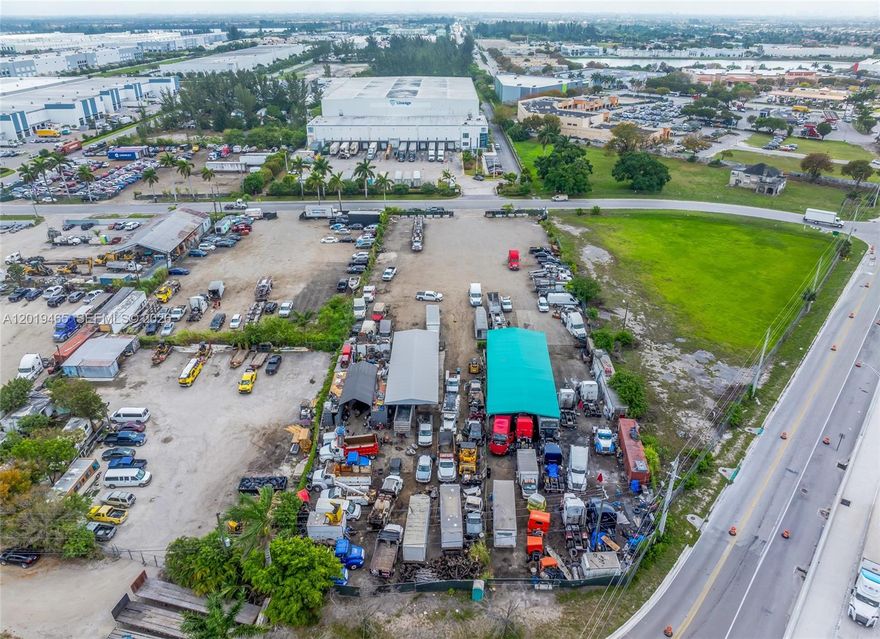 Located on NW 112th Avenue, this industrial land presents a rare covered land play opportunity in Hialeah Gardens. Spanning nearly 2 acres, this income-generating property offers immediate cash flow with long-term development upside. Strategically positioned just yards from Okeechobee Road, which sees over 30,000 vehicles daily, and less than 0.4 miles from Florida’s Turnpike— with a staggering 100,000+ daily car count—this site offers exceptional accessibility and visibility. In fact, the property is visible from the Turnpike, making it a prime location for any user seeking to capitalize on high traffic exposure. Zoned industrial, permitted uses include auto painting and body shops, gas and service stations, new and used vehicle sales, and outdoor storage, among others. Whether you’re an owner-user looking for a high-visibility site or an investor seeking value-add upside, this property checks all the boxes—strategic location, strong income, and development-ready infrastructure.