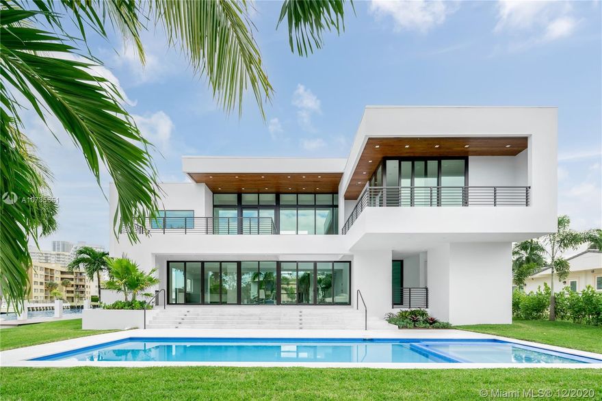 30 days from completion!!! This BRAND NEW construction modern masterpiece offers luxury living at its finest and a private oasis in the exclusive gated waterfront community of Golden Isles. This stunning estate is situated on a corner point lot with 240 FT of Water frontage. Over 6,000 SF of living space finished with marble, stone, and wood accents make this a one of a kind designed home. Features include 7 large suites, 8 bathrooms, 2 car garage + 2 car covered parking, staff room, family rooms, oversized elevator, Mia Cucina Italian kitchen, summer kitchen and a brand new 100 FT professional equipped dock installed. Be the first one to live in this architectural masterpiece designed by renowned Jose Sanchez from Praxis Architecture. Call or text listing agent.