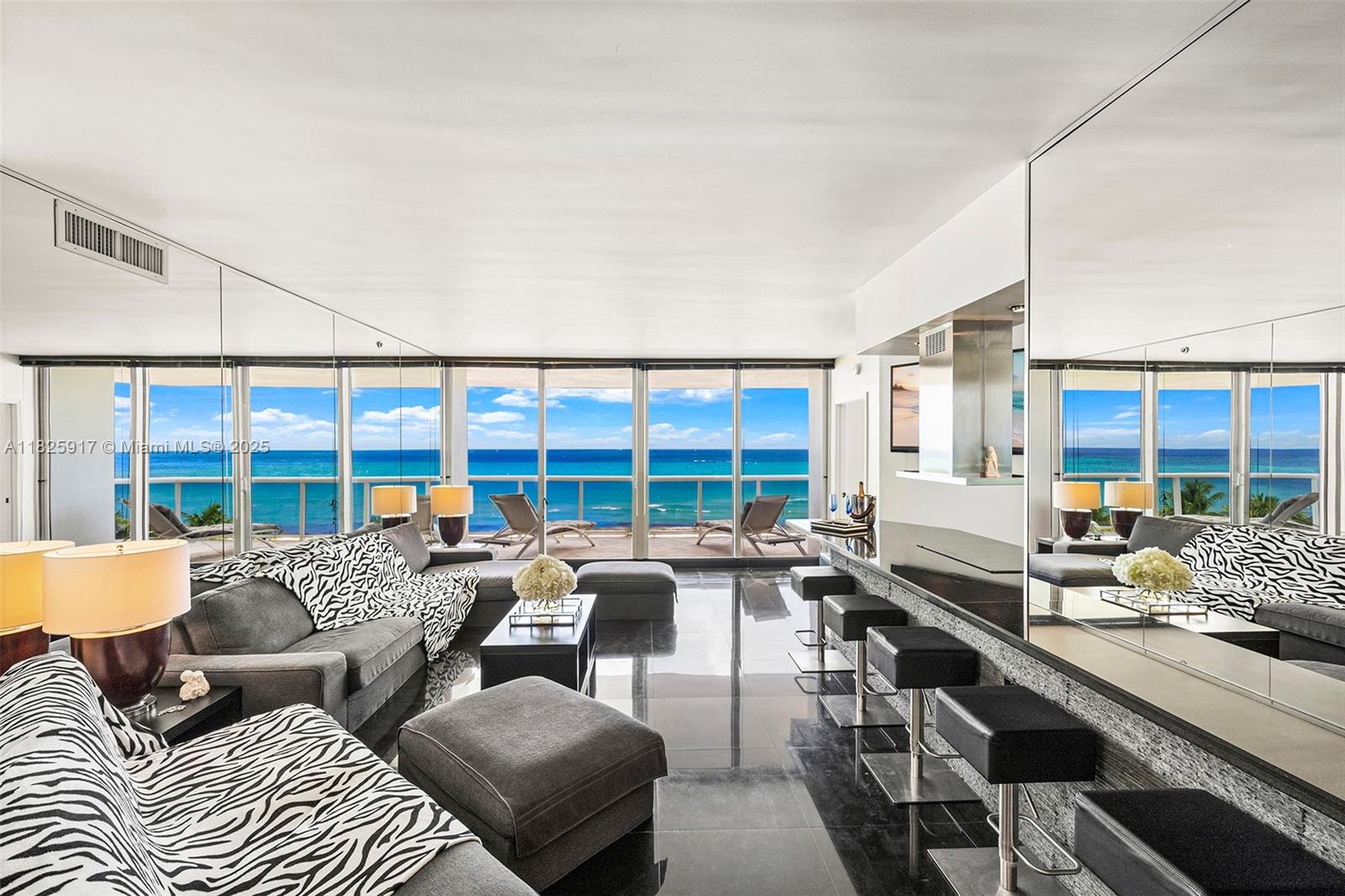 This beautifully appointed residence is situated on a low floor, offering a unique connection to the ocean with tranquil views and refreshing breezes enjoyed from the expansive terrace.
The thoughtfully designed split floor plan features 2 bedrooms plus a den and 2 bathrooms, with floor-to-ceiling windows that flood the space with natural light and showcase ocean views from every room. The open kitchen flows seamlessly into the spacious living and dining area, creating an inviting setting for everyday living or entertaining. The primary suite includes a spacious walk-in closet and a large bathroom with marble walls, separate shower, and jacuzzi tub.
Residents enjoy resort-style amenities .